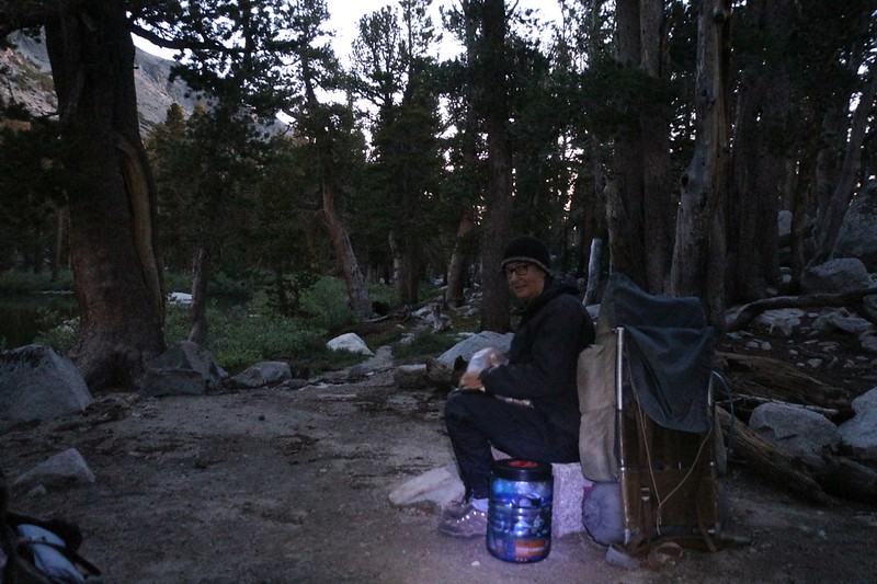 We woke up in the dark to begin hiking at dawn - here is Vicki in the light of my headlamp packing up