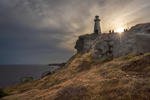 canada capespear lighthouse newfoundland saintjohn saintjohns shawnharquail silhouette stjohn stjohns sunset tower travel cliff cloud clouds landscape mountain ocean outdoor rays shawnharquailcom sky sun sunrays sunstar vista water