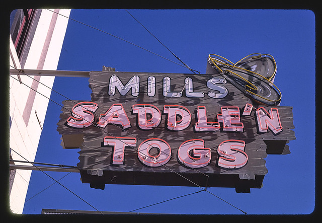 Mills Saddle N' Togs sign, 4th & Main Street, Ellensburg, Washington (LOC)