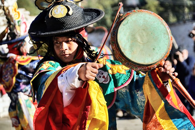 Folk dancer with drum, village festival, Chokhor Valley, Bhutan