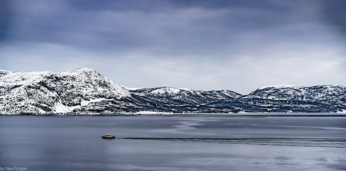 View of mountains across the fjord from Alta, Norway-2 by Yasu Torigoe, 
Alta is a town on Norway’s northern coast, at the head of Alta Fjord. It’s known for views of the N