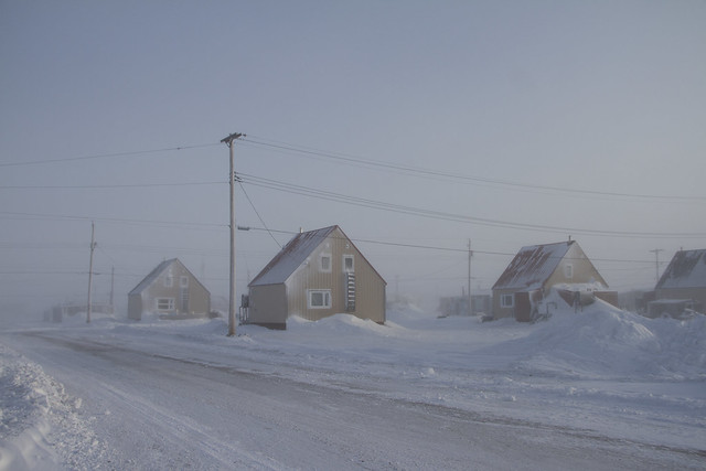 Arctic community covered in snow following a big blizzard