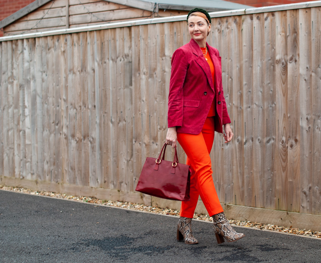 How to Wear Red With Orange: red corduroy blazer, orange sweater, orange tailored trousers, snakeskin boots | Not Dressed As Lamb, over 40 style blog