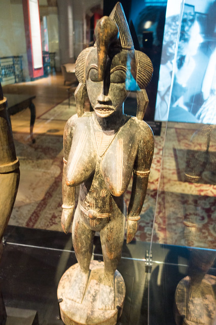 African carving of woman with scarred breasts