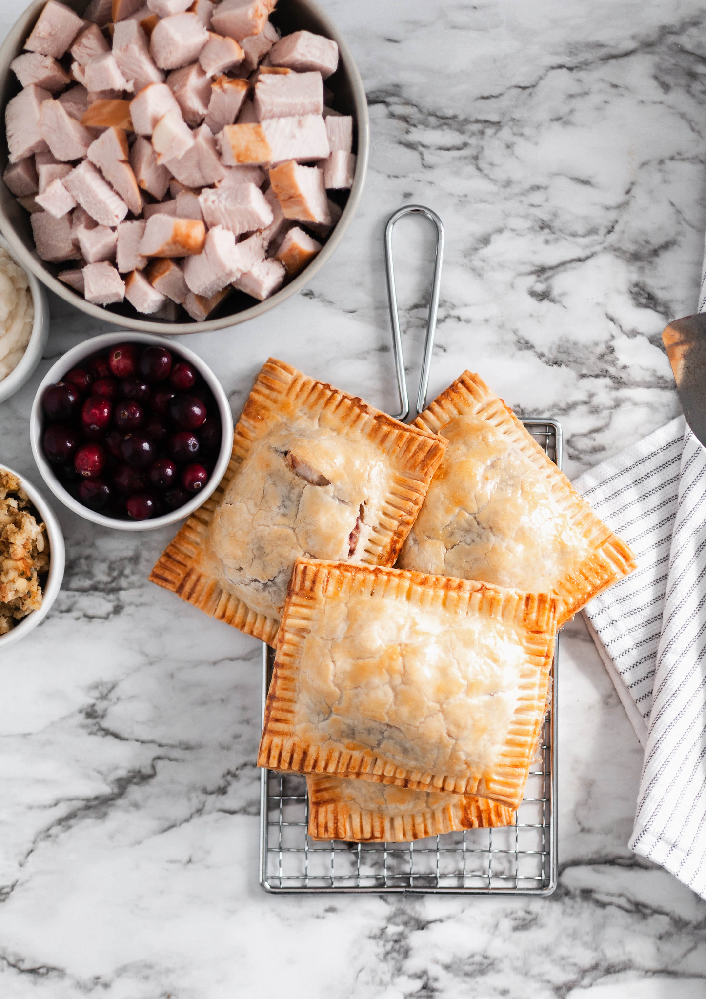 Repurpose your delicious Thanksgiving leftovers and make these Thanksgiving Leftovers Hot Pockets. I've teamed up with the National Turkey Federation to bring you a turkey-licious recipe that you'll love this fall and all year long. Mashed potatoes, stuffing, cranberry sauce and turkey cooked in flaky pie dough to golden perfection.