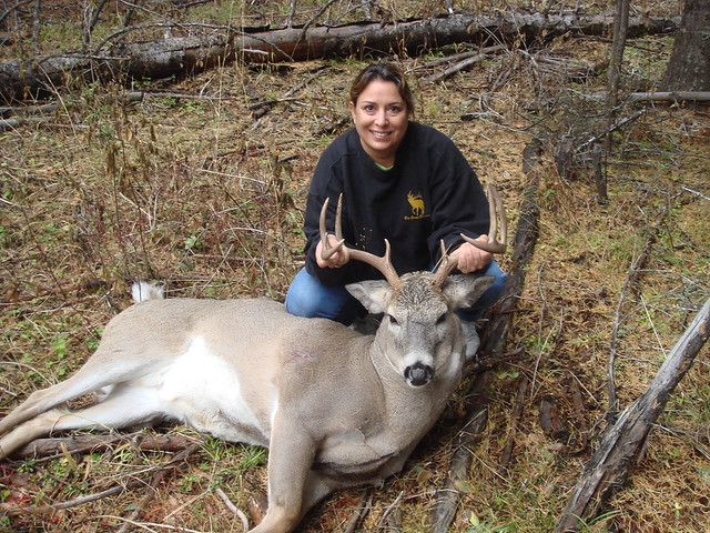 Sandra Broncheau-Mcfarland with a white tail buck taken during a hunt