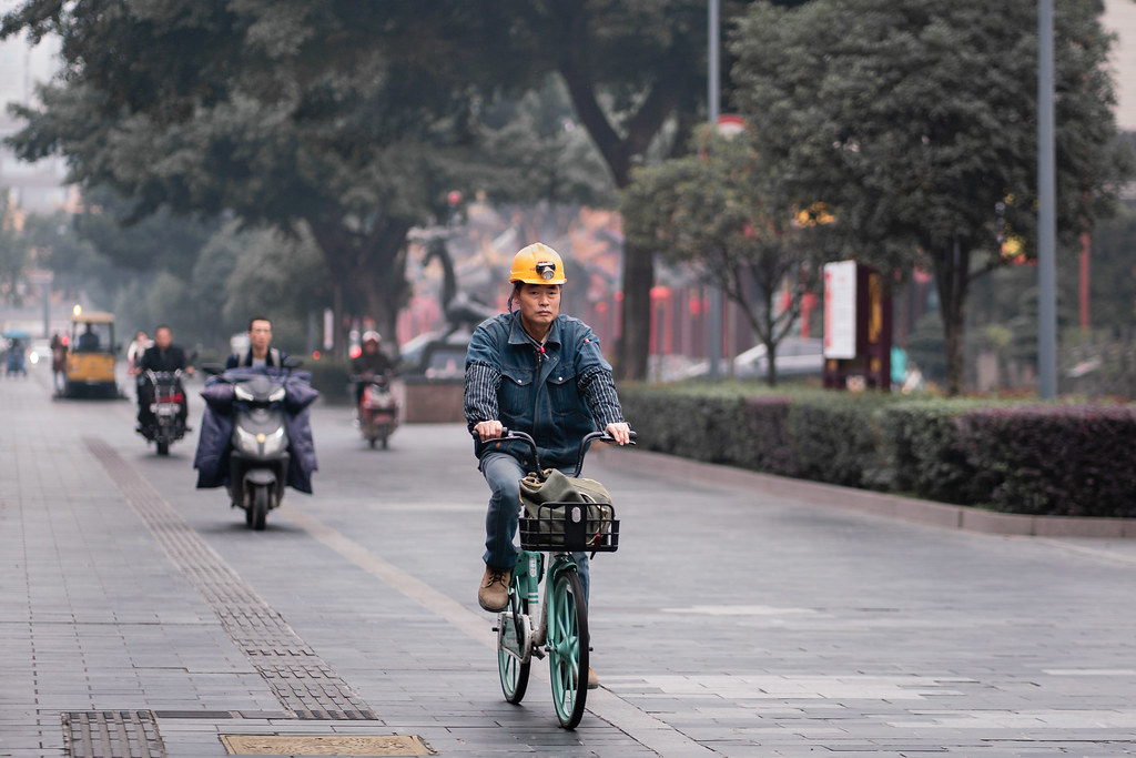 Construction worker biking to work in Chengdu 成都, China