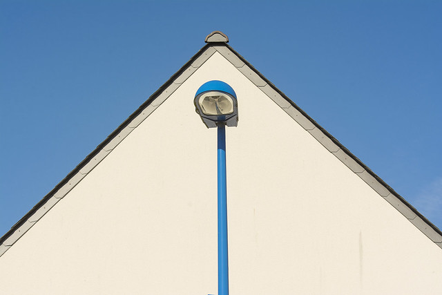 House and blue lamp post