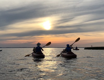 kayakers watching sunset in Back Bay