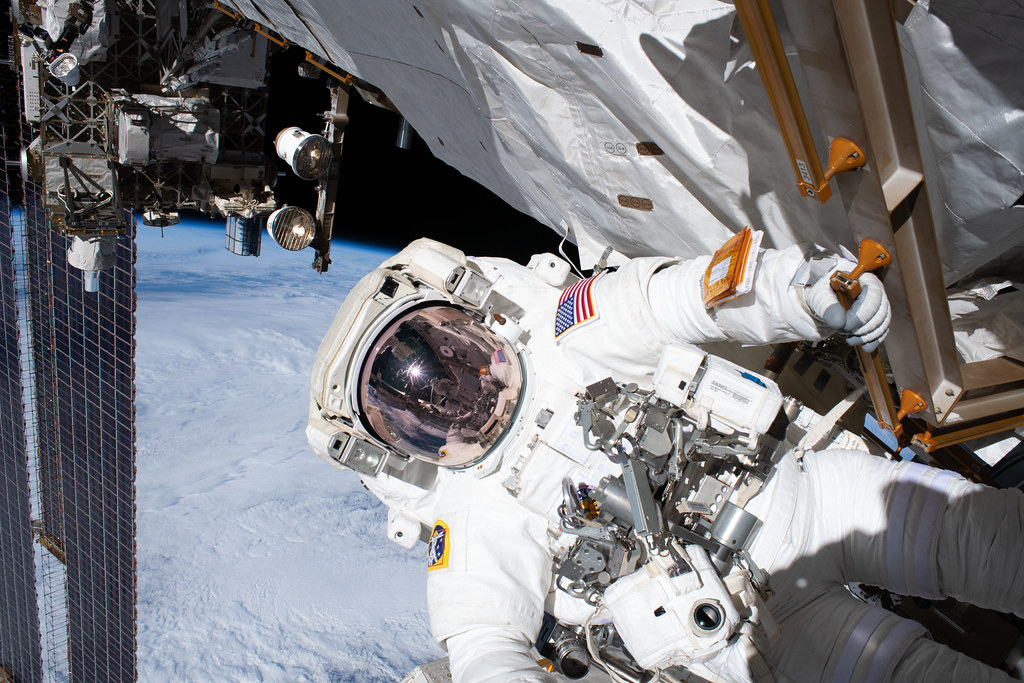 Andrew R. Morgan Astronaut Andrew Morgan holds on to a handrail | iss061e0582… | Flickr