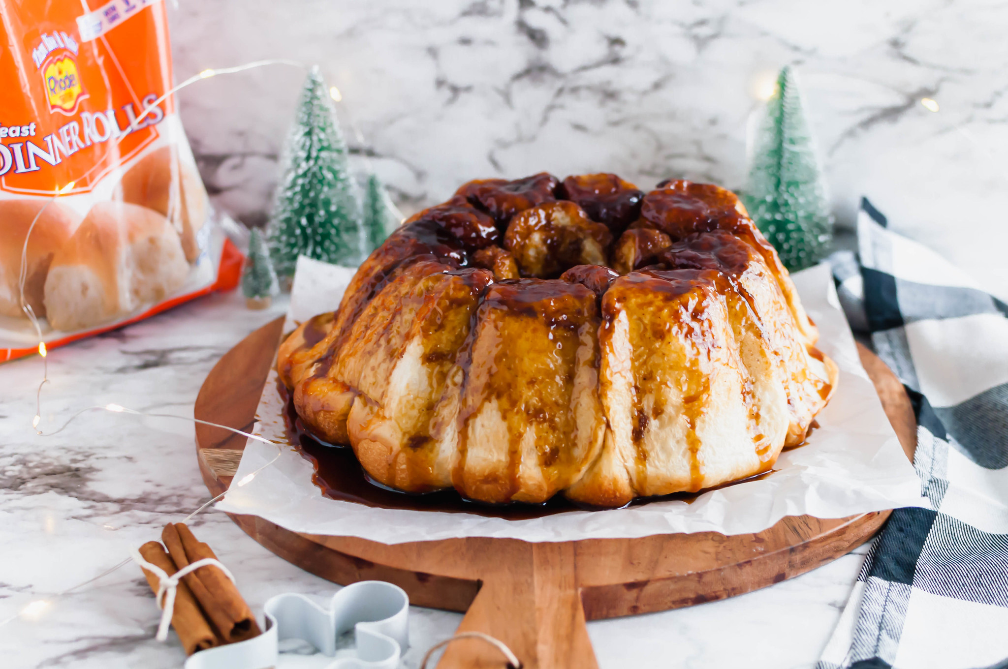 Make your holiday mornings even sweeter with this make ahead Gingerbread Monkey Bread. Prepare the night before and bake Christmas morning. It's filled with so much holiday flavor.