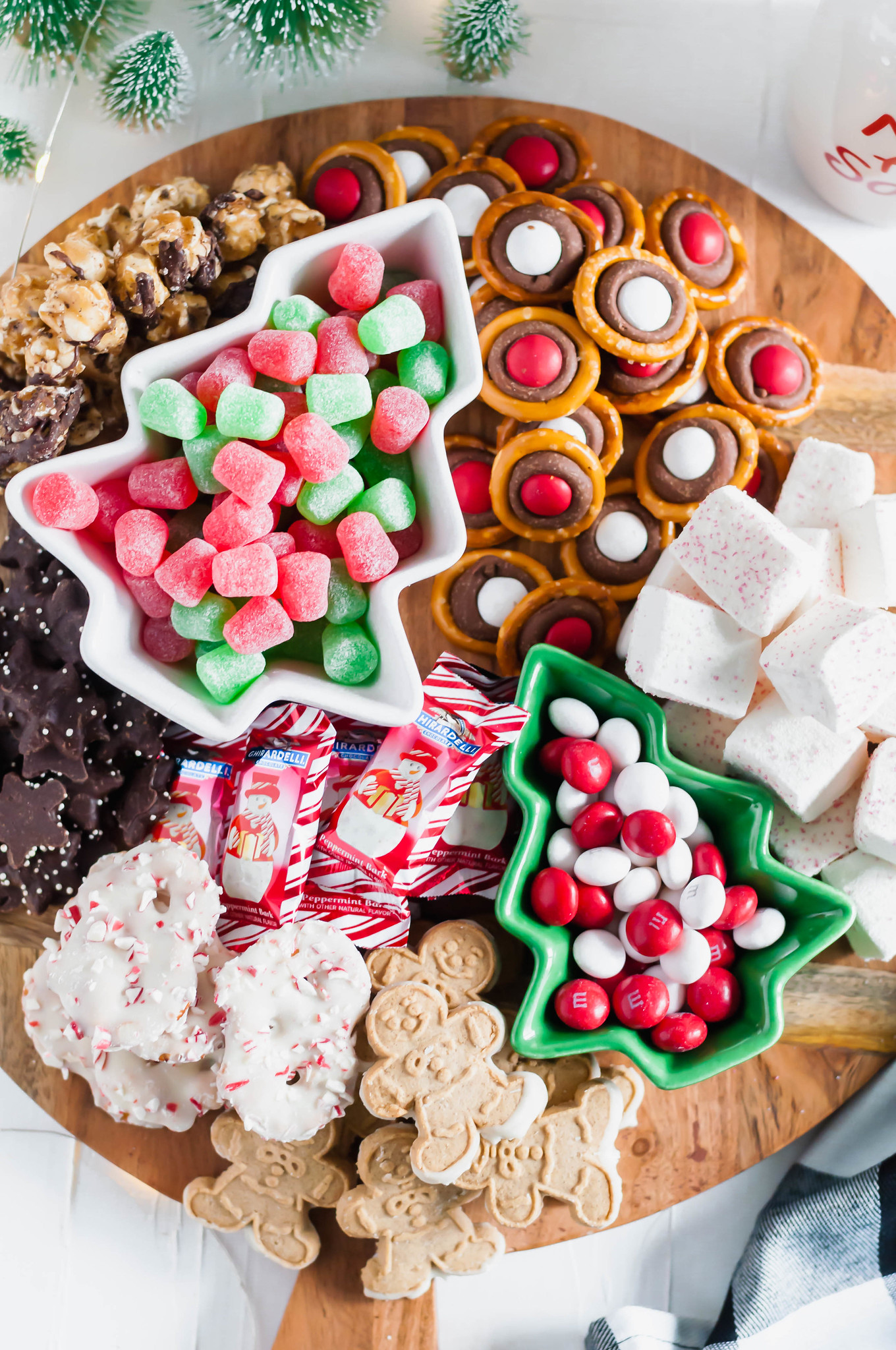 This Easy Christmas Dessert Board will be the talk of your Christmas party. A homemade treat or two filled in with fun, festive cookies and candies.