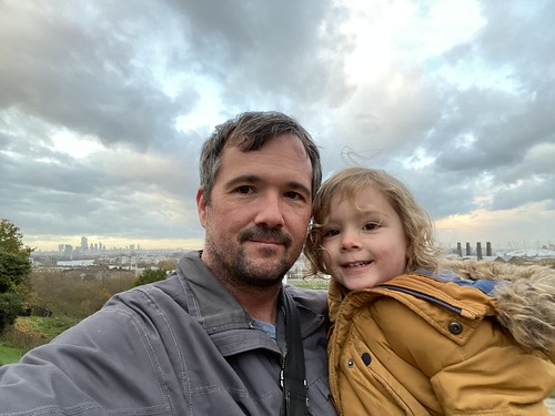 Me with my younger son at the top of a large hill in London