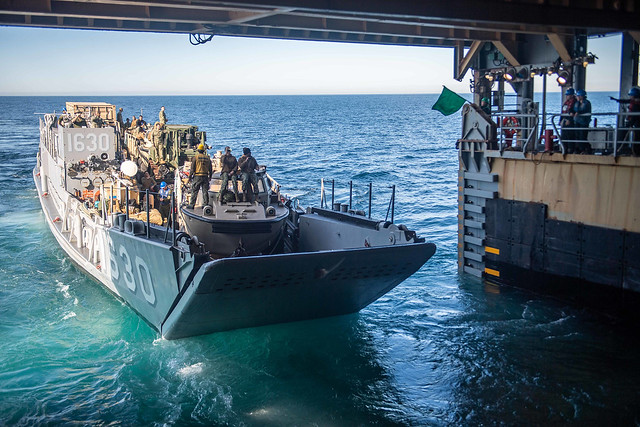 Landing Craft, Utility 1630 exits the well deck of the amphibious dock landing ship USS Harpers Ferry