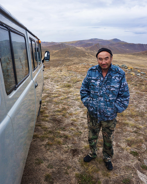 Russia, Olkhon Island - Buryat van driver in the bare steppe - September 2018
