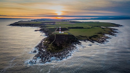 sunset aerial lighthouse scotland