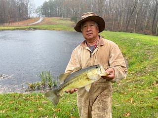 Photo of man holding a largemouth bass.