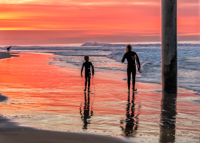 Father and Son Surfing at Sunrise, Huntington Beach CA