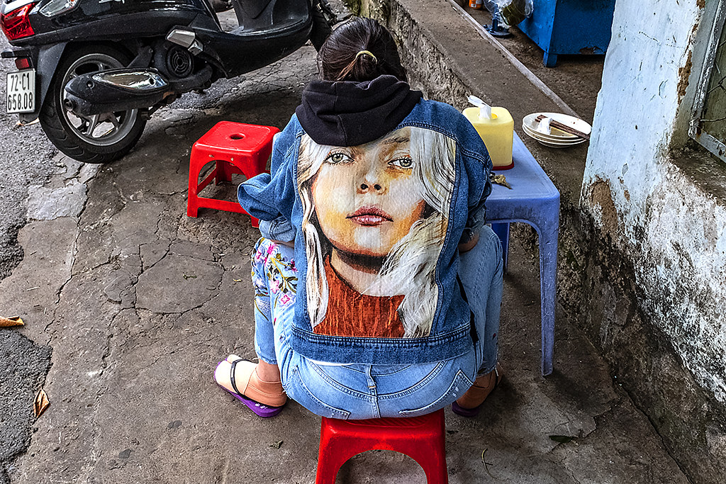 Blonde on back of woman's jean jacket--Vung Tau