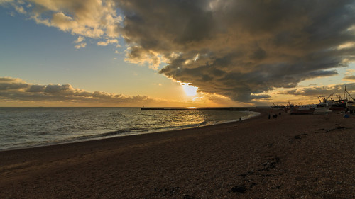 hastings east sussex sun set sunset beach sea coast waves clouds old town