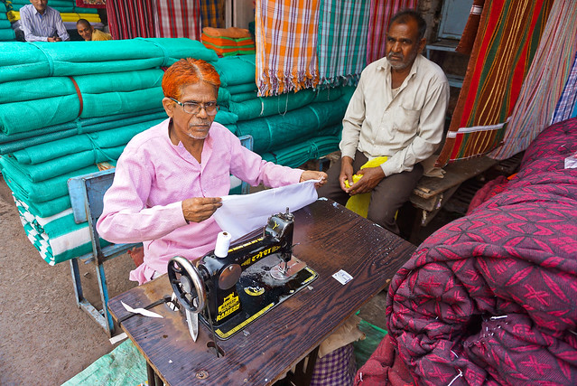 India, Bhopal - Tailor and his sewing machine at work - February 2018