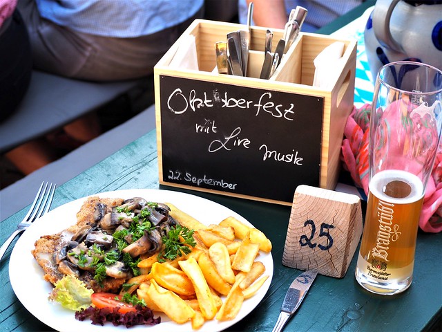 Schnitzel with Pommes and a Alcohol free Beer - A meal in the Beer Garden of the Restaurant Zum Heurigen near Frankfurt during a Festival with Alpine Music with Motto October Festival - Germany 2019