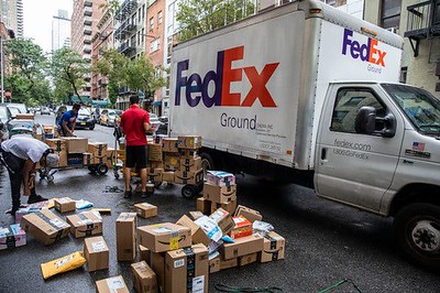 FedEx  worker sorts packages in Upper East Side, Manhattan