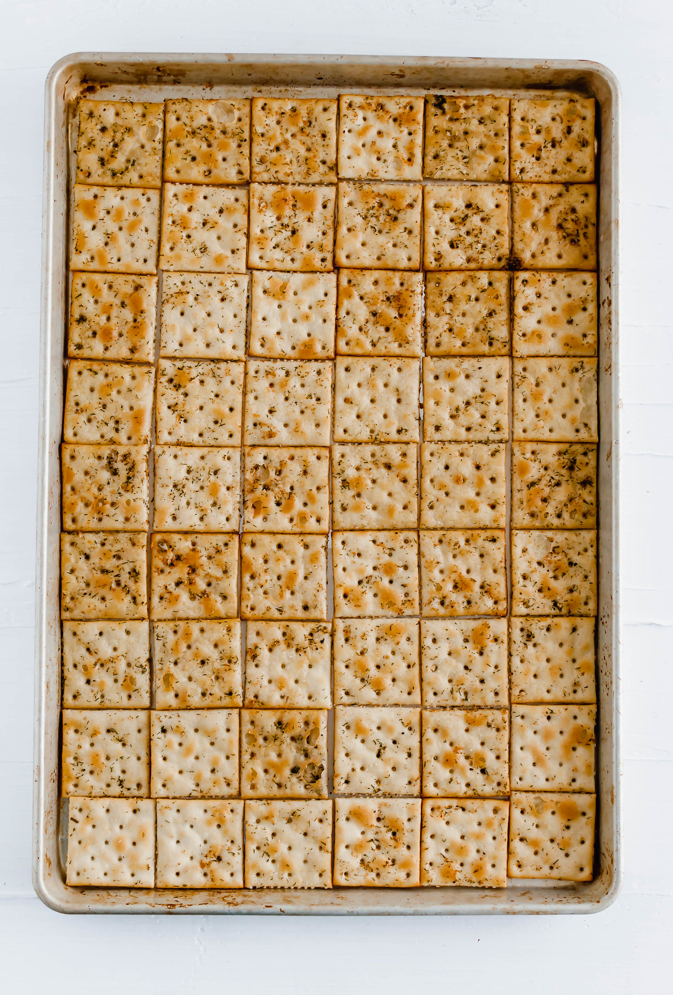 Seasoned Saltine Crackers are wonderful as a snack or a dipper for all the soups this winter. Tossed in oil, spices and herbs then baked to crispy perfection.