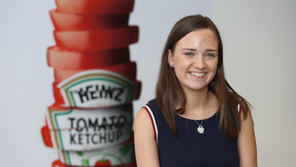 Francesca beside a Heinz ketchup poster