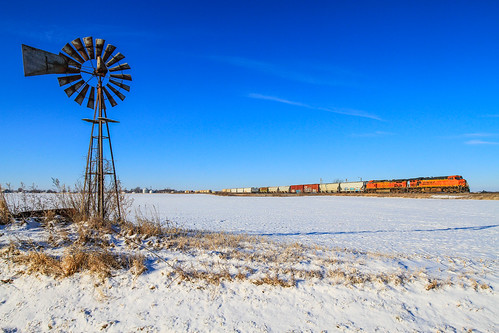 train railroad bnsf railway ge emd locomotive illinois snow windmill farm rural landscape cold midwest freight commerce rails signals