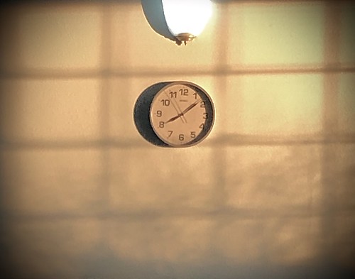 wall clock light shadows 813am time