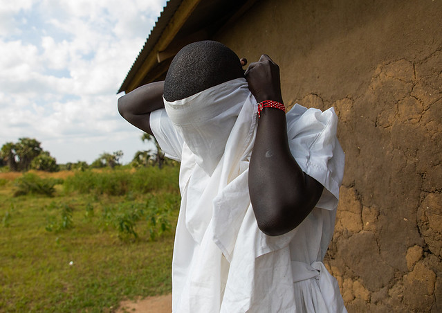 Mundari tribe nun putting her veil before a mass, Central Equatoria, Terekeka, South Sudan