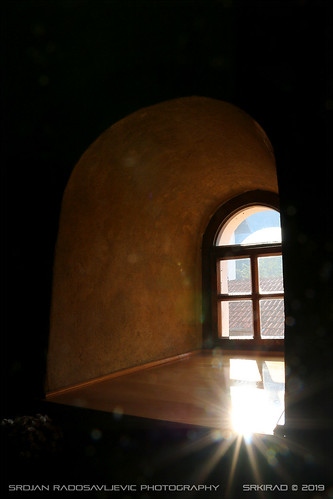 travel serbia srbija monastery church vitovnica interior window flare sun dark light