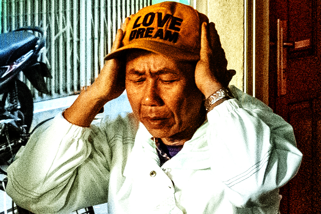 Man wearing LOVE DREAM baseball cap--Nha Trang (detail)