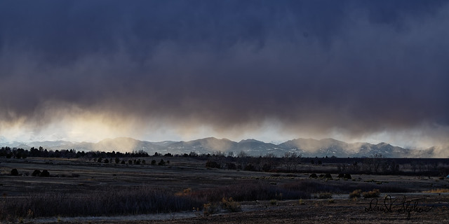 Mix of Virga Rain And Rain In Front of Rocky Mountains