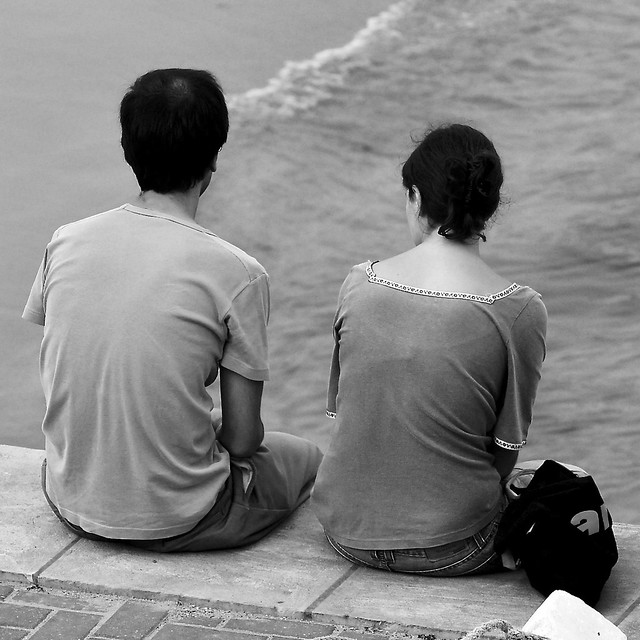 Calm couple observing Tagus River
