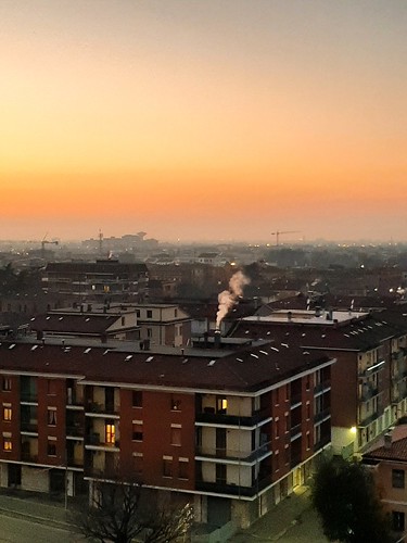 Modena, 2019-12-30 by oltrelautostrada, italy modena emilia romagna sunset city high pov roofs sky red colorful vertical wintertime smog fog