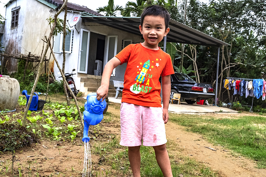 Lieu Thai's second son compulsively watering the plants--Dien Minh
