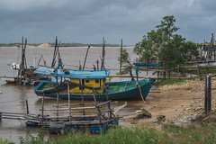 Fishing boat by the river 2