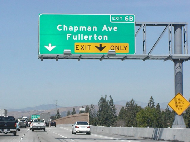 State Highway Junction Route CA-57 Northbound Orange Freeway approaching Exit 6B - Chapman Avenue Fullerton on an Auxiliary Right Lane Must Exit - EXIT ONLY out of two right lanes may exit Next Right Exit 1/4 = 0.25 Mile Ahead