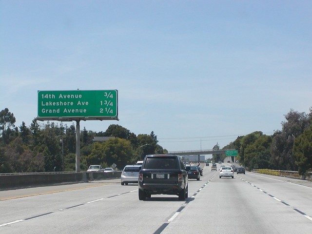 Interstate 580 Westbound General Douglas MacArthur Freeway provides mileage distance exits approaching Exit 22B - 14th Avenue and Park Blvd. Next Right Exit 3/4 = 0.75 Mile to 1/2 = 0.5 Mile to 1/4 = 0.25 Mile Ahead followed by Exit 22A - Lakeshore Avenue