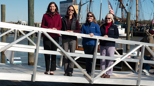 Photo of four women on the gangway leading to a boat