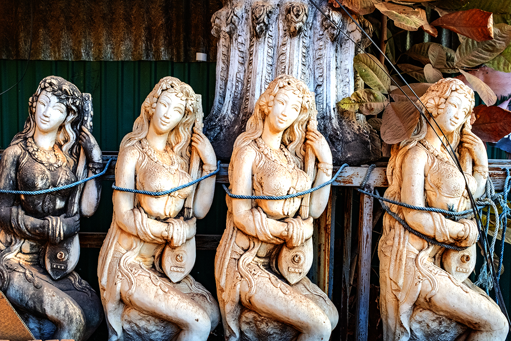 Statues of lute strumming women--Savannakhet