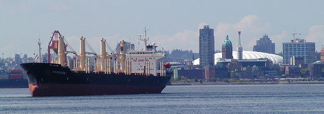 Marquisa moored in Burrard Inlet, Vancouver Harbour, flanked by Vancouver  city