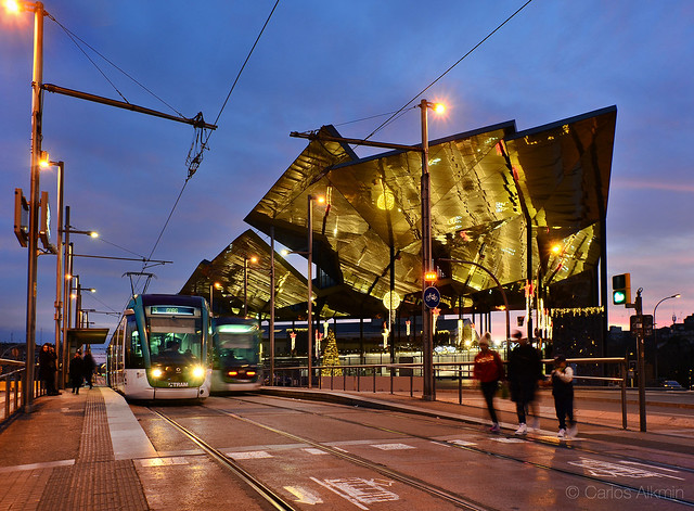 Barcelona, Spain - Trams and one more sample of Barcelona's audacious architecture, at dusk