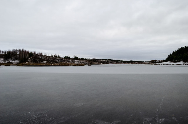 The lake was partially covered with ice in late autumn.