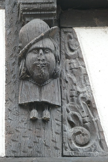 relief carving of a man in a hat