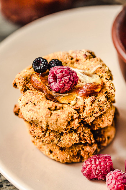 Oatmeal vegan cookies with raspberry jam and date caramel. Close-up.
