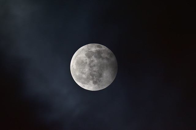 Penumbral lunar eclipse and clouds