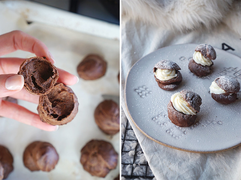 Airy inside chocolate profiteroles with sweetened cream cheese filling and a dusting of icing sugar | made with gluten free chocolate choux pastry